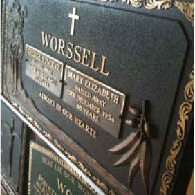 Bronze memorial plaque with floral rose motif